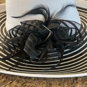 Elegant Black and White Women's Derby Hat with black feathers